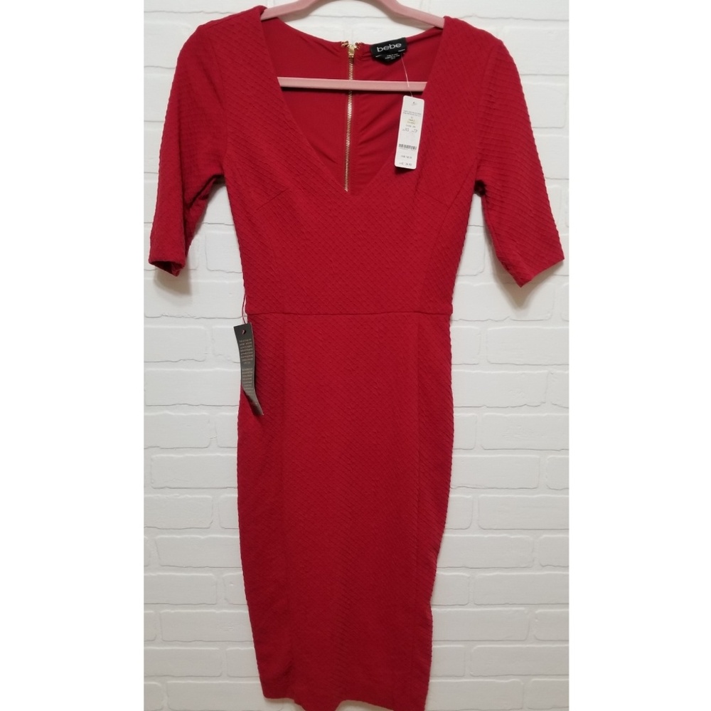 Red Bebe dress in size XS with gold zipper details